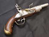 an old gun that is on a black cloth