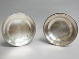 pair of silverplated bowls with raised rims and raised rims