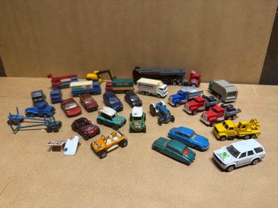 a lot of toy cars and trucks on the table