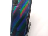 an image of a close up of a cell phone on a stand