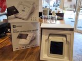 two boxes on a table with a printer on it