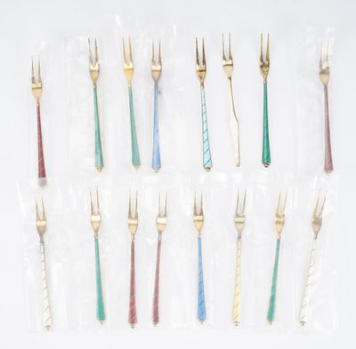 a set of twelve gold and silver forks with different colored handles