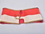 an image of a red and white belt with a gold buckle