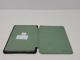 a green case that is open on a white table