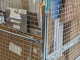 a metal cart with a lot of boxes in it