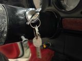 a car dashboard with a bunch of keys in it