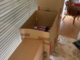 many boxes stacked on top of each other in a room