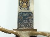 a close up of a sword with a plaque on it