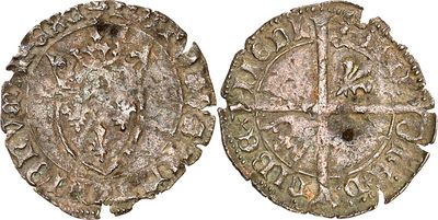 a close up of two old silver coins on a white background