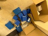 a pile of boxes sitting on the floor next to a wall