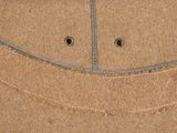 a picture of a close up of a piece of brown material
