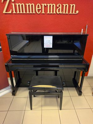 a piano and a stool in a room
