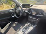 the interior of a car with a steering wheel and dashboard controls