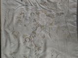 a picture of a piece of cloth with birds and flowers on it