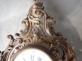 a clock that is hanging on the wall in the room