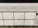 an image of a stack of white refrigerators sitting on top of a floor
