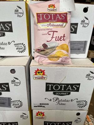 several boxes of potato chips are stacked on top of each other
