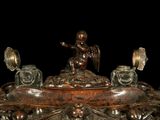 a statue of an angel sitting on top of a table