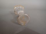 a close up of a small glass object on a table