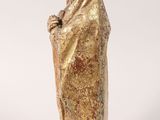a statue of a woman with a veil on her head