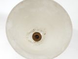 a white sink with a brown faucet in it