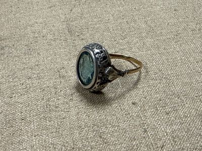 a ring that has a stone in it on the ground