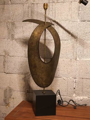 a lamp that is sitting on a table next to a lamp