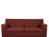 a red couch sitting on top of a white floor next to a white wall
