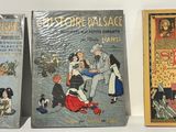 three books that are sitting on a table