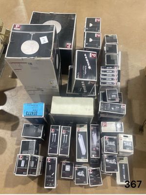 many boxes of electronic equipment on the floor