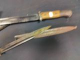 two knives that are sitting on a table
