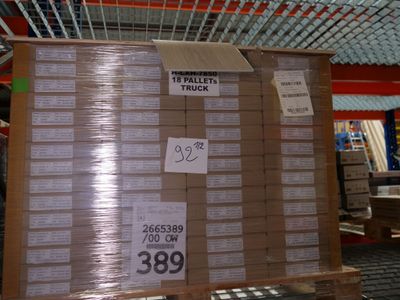 a pallet with a lot of boxes on it in a warehouse
