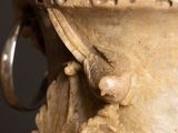 a large vase with a flower decoration on it
