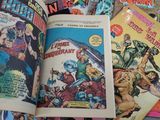 a lot of comic books that are on the table