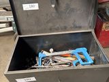 a metal tool box with tools in it on the floor
