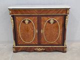 a wooden cabinet with two doors and a marble top