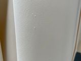 a close up of a white chair with a white seat