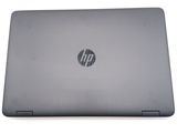 the back view of a laptop computer with a hp logo on the screen