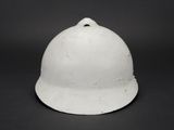 an old white helmet on a black background with a black background