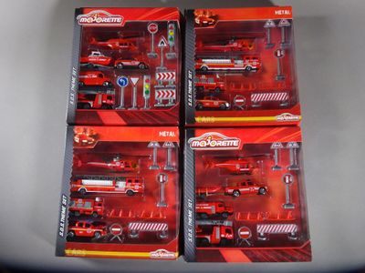 four red firetrucks that are in the box