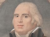 portrait of a man wearing a brown coat and a white shirt