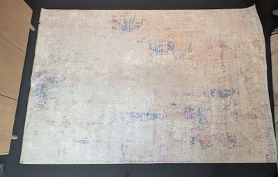 a large piece of fabric on the floor of a room