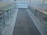 a glass display case in the middle of a long hallway