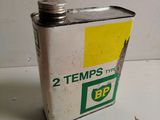 a small tin of oil sitting on a table