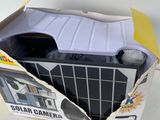 a box with a toy car inside of it on a table