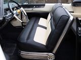 a black and white interior of a car with a steering wheel