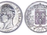 a close up of a coin with a crown on it