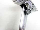 a silver sword with an eagle on top of it