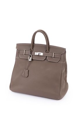 a brown leather handbag on a white background