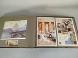 an open book with pictures of people on it sitting on a table